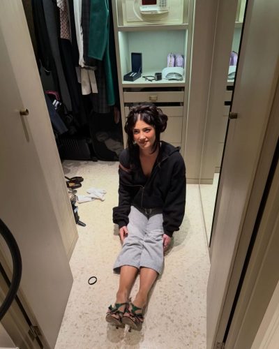 Charli D’Amelio colorful dress with unique design and sparkling earrings