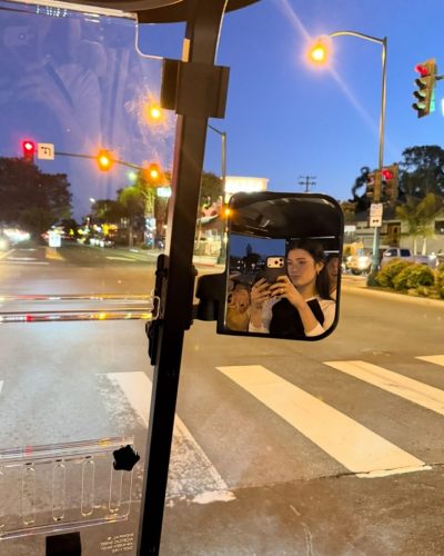 Charli D’Amelio colorful dress with intricate details and bold statement earrings