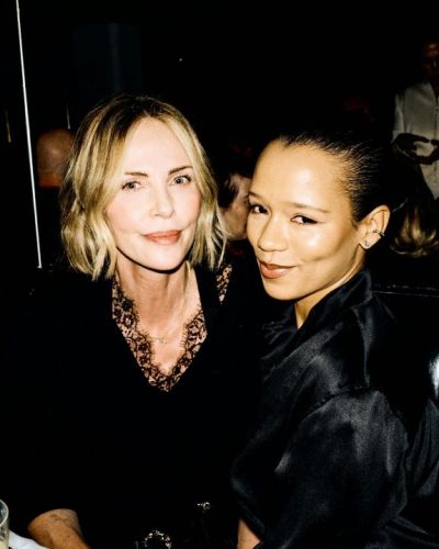 Charlize Theron elegant black fitted shorts and lace top