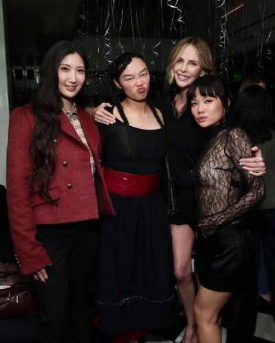 Charlize Theron fitted black shorts and lace detail top