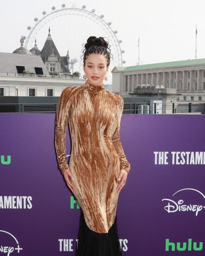 Chase Infinity Charms In Brown Dress At The Testaments 2023 5