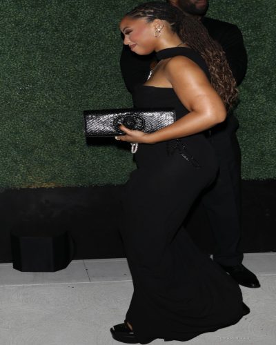 Choe Bailey in a black gown complemented by statement pieces