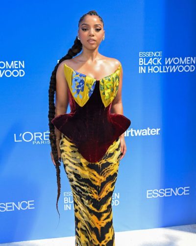 Chloe Bailey in floral print gown with intricate shoulder details.