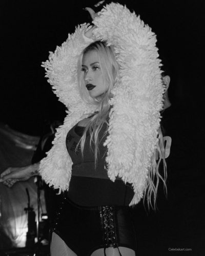 Christina Aguilera in black thigh-high boots and fitted bodysuit