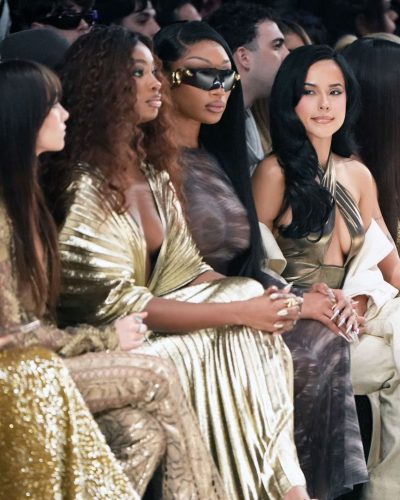 Coco Jones in glamorous gold gown with sophisticated pleating