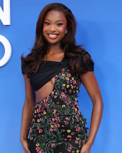 Coco Jones wearing floral gown with open back and side slit