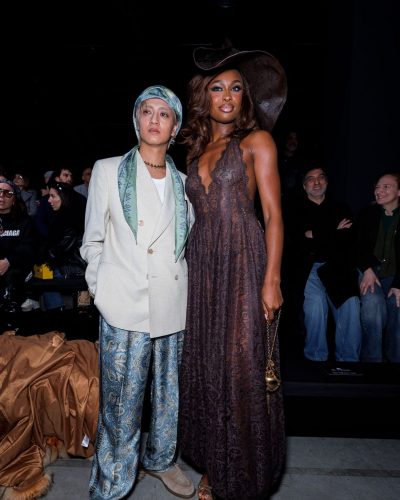 Coco Jones in a stylish gown with bold lace patterns