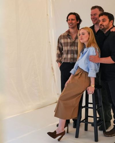 Debby Ryan in elegant white gown with intricate lace details.