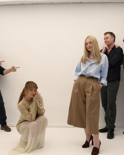 Debby Ryan in sophisticated black jumpsuit with wide legs.