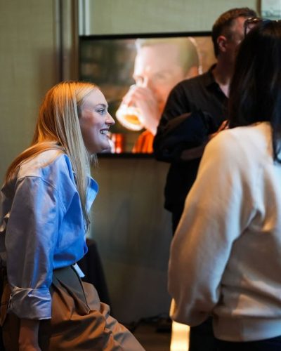 Debby Ryan in elegant white gown with intricate lace details.