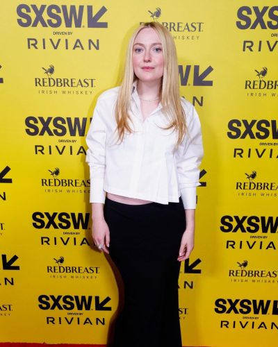 Dakota Fanning in black skirt and white top combination