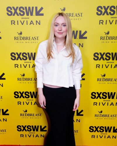 Dakota Fanning in white shirt with stylish black tailored skirt