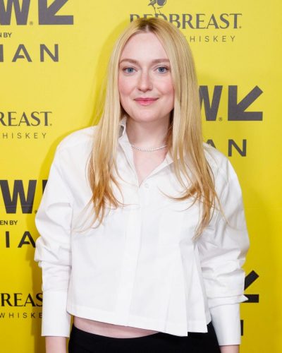 Dakota Fanning wearing tailored black skirt with white shirt