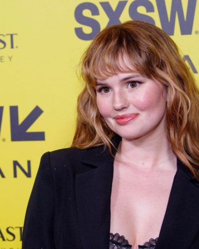 Debby Ryan in modern black suit with chic details