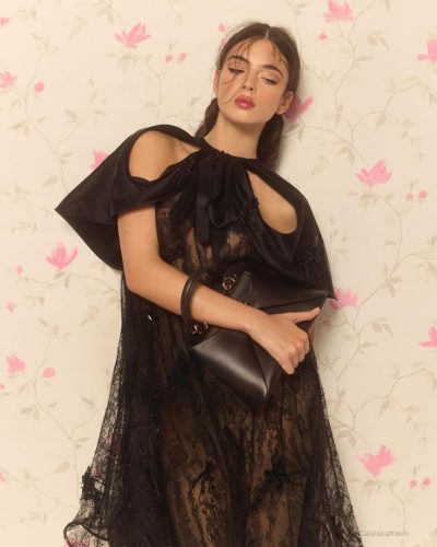 Deva Cassel in lightweight flowy fabric floral jumpsuit.