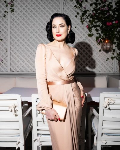 Dita Von Teese a vintage-inspired gown with sophistication.