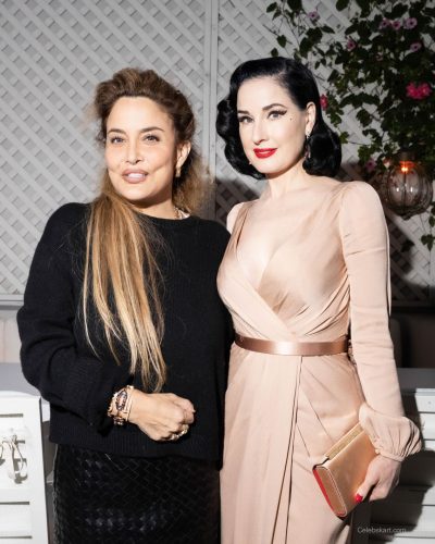 Dita Von Teese in a classic gown with statement earrings.