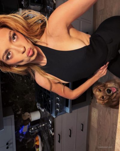 Dixie D'Amelio in pastel yellow sundress with floral accents