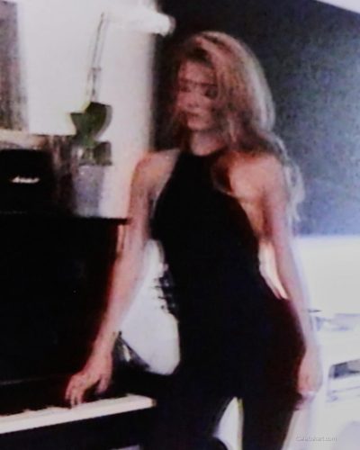 Dixie D'Amelio in chic grey blazer over fitted black trousers