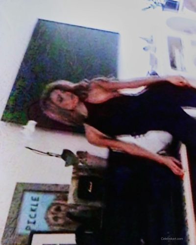 Dixie D'Amelio wearing bright red mini dress with puff sleeves