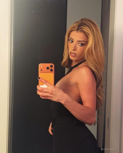 Dixie D'Amelio in classic navy blue turtleneck with plaid pants