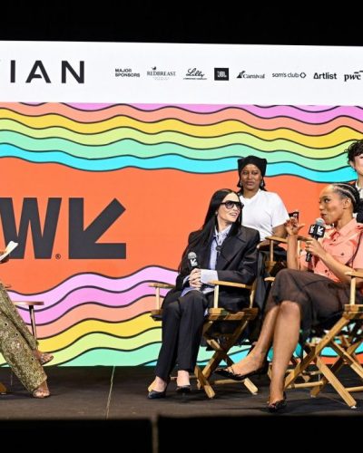 Eiza Gonzalez in radiant red gown with flowing waves