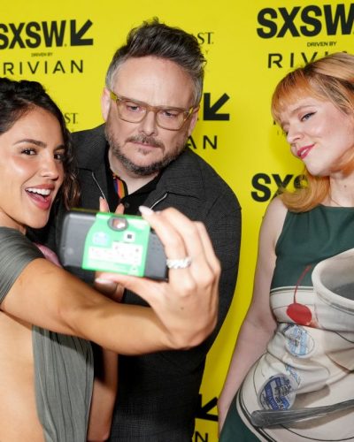 Eiza Gonzalez in a luxurious burgundy gown with intricate details.