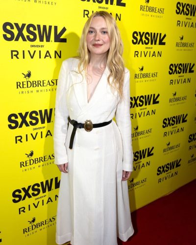 Elle Fanning in a bright red dress with soft lighting