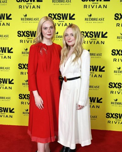 Dakota Fanning in a white dress accentuated with a chic handbag