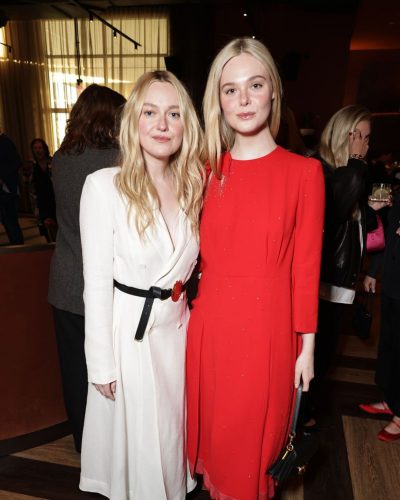 Elle Fanning in a red gown featuring elegant draping
