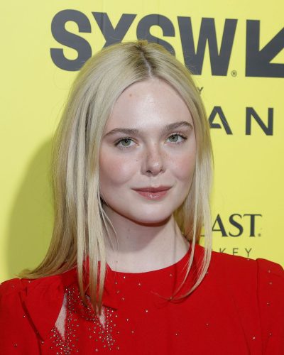 Elle Fanning in eye-catching red dress with fitted bodice