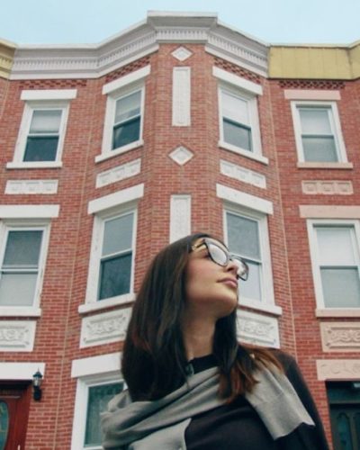 Emily Ratajkowski in soft pink dress with oversized shades