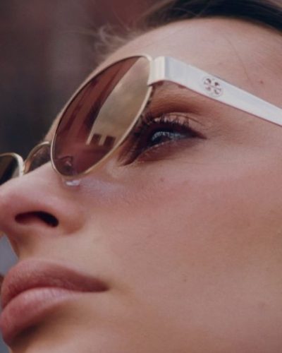 Emily Ratajkowski in delicate floral gown with edgy sunglasses