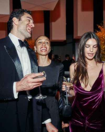 Emily Ratajkowski burgundy gown featuring soft flare and side cutouts.