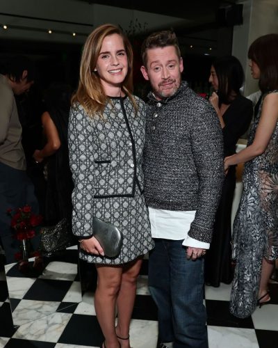 Emma Watson in a chic black dress with understated beauty