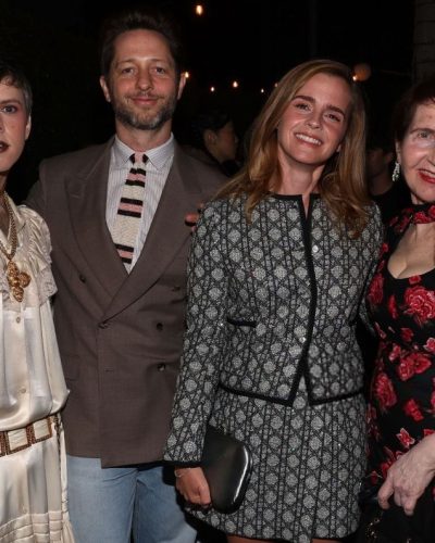 Emma Watson in understated black gown with warm beauty choices