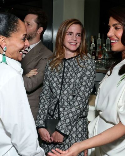 Emma Watson in a sleek black gown with flowing hair