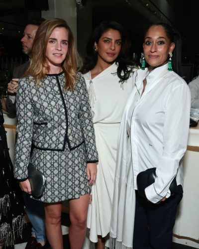 Emma Watson in simple black dress with subtle lip color