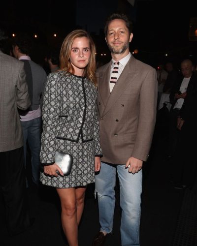 Emma Watson in modern black dress with classic styling