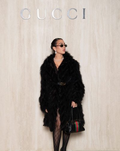 Georgina Rodriguez with statement jewelry and fashionable black tights