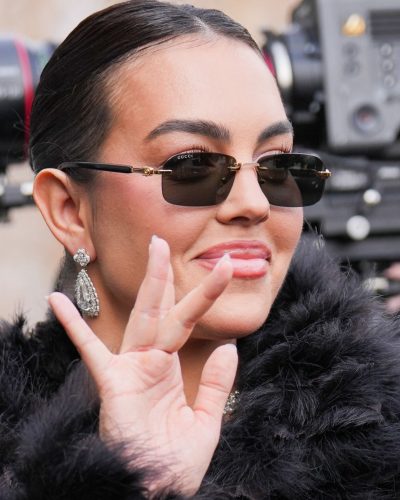 Georgina Rodriguez with stylish black sunglasses and diamond accessories.