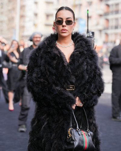 Georgina Rodriguez a black gown with elegant accessories.