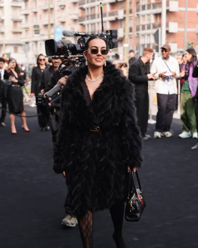 Georgina Rodriguez sporting a chic black dress and fluffy coat.