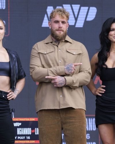 Gina Carano black crop top with edgy leather jacket