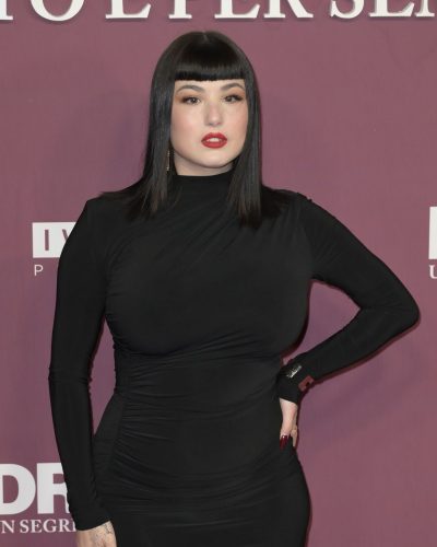 Giorgia Soleri modern black dress with bright red lip makeup