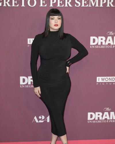 Giorgia Soleri sleek black gown featuring elegant flowing fabric