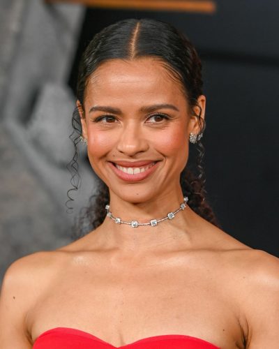 Gugu Mbatha-Raw soft waves hairstyle complementing red dress