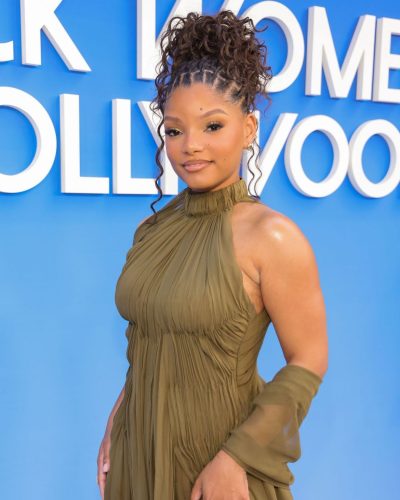 Halle Bailey in elegant side slit dress with shimmering accents