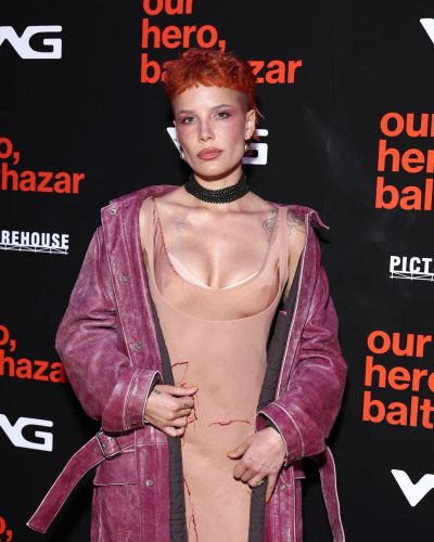 Halsey with orange hair and a nude fitted dress.