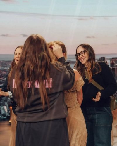 Hilary Duff in beige off-the-shoulder dress with ruffled neckline